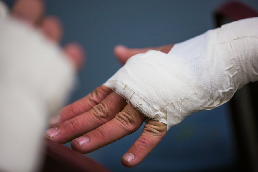 A bandaged hand receiving follow-up care after a dog bite
