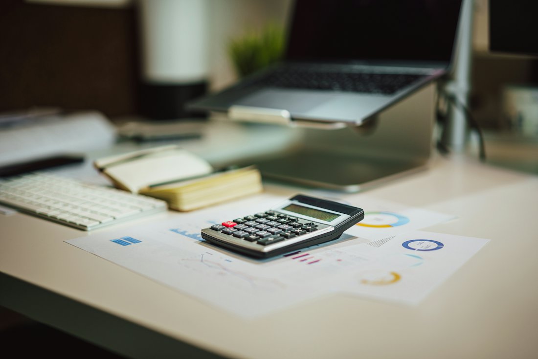 A calculator and paperwork used to estimate a claim