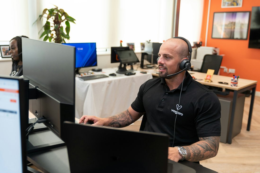 A claim specialist on a headset answering questions
