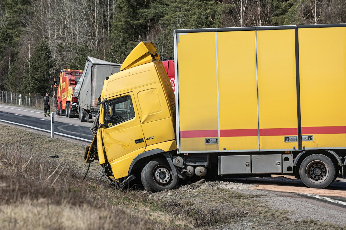 A commercial truck that has left the highway after a crash