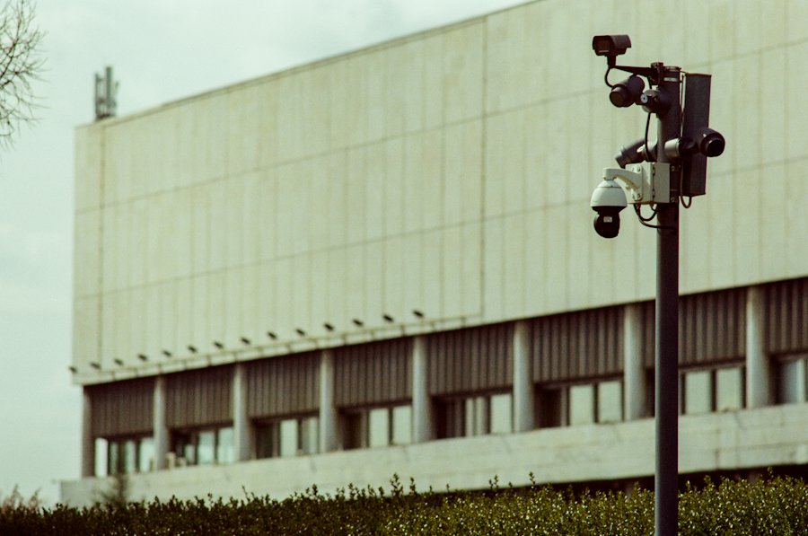 Security cameras mounted outside a building that can capture a nearby crossing