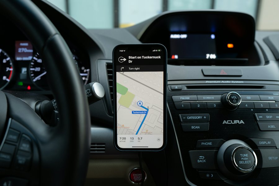 A phone mounted on a car dashboard showing a trip in a navigation app