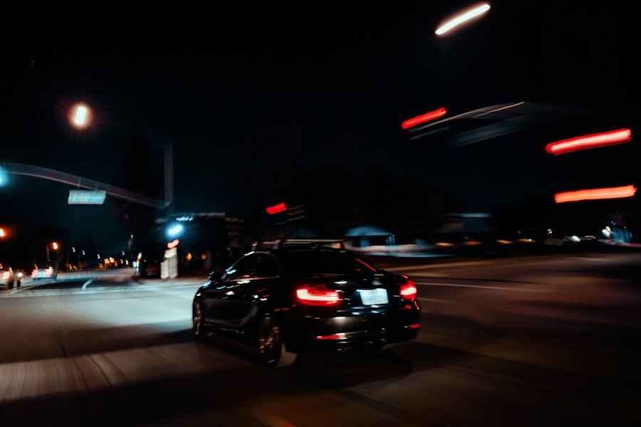 A rideshare car driving through the city at night between trips